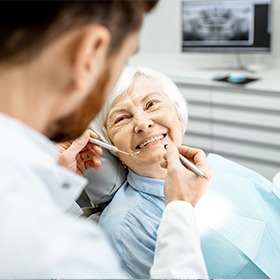 Smiling older woman in dental chair