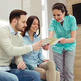 Man and woman looking at dental insurance paperwork