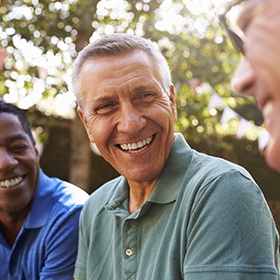 Laughing older man outdoors