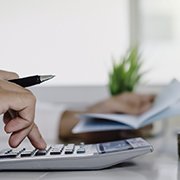 Man calculating cost of dentures in Goode