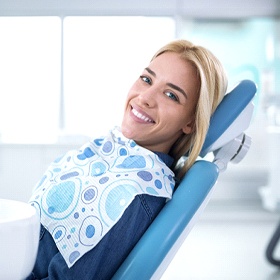 Woman smiling after treatment for a dental emergency in Goode