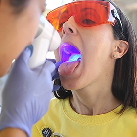 Woman receiving oral cancer screening