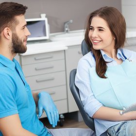 a patient talking to their dentist about SureSmile