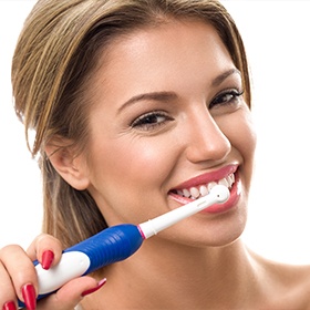 Woman brushing teeth