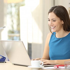 A woman working on a computer.