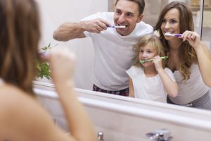 Your family dentist in Goode instructs on proper teeth brushing.