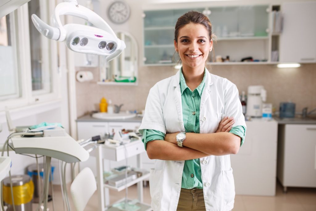Closeup of female dentist smiling in office