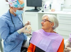 woman listening to her dentist discuss dental implants
