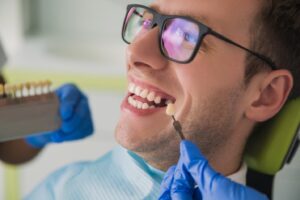 Dental patient receiving veneer treatment.